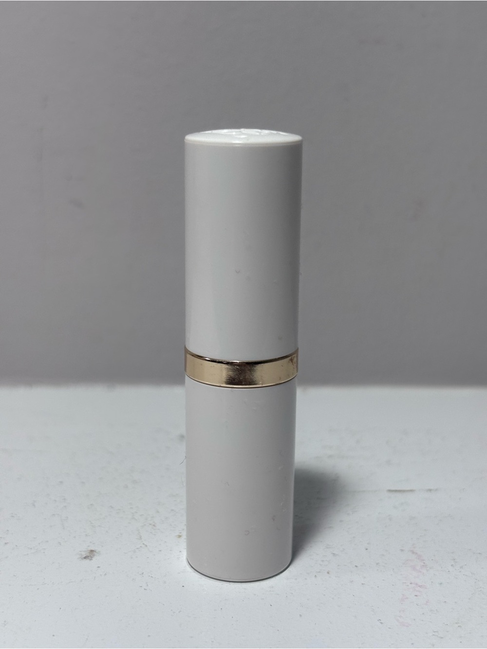 Estée Lauder Lip Conditioner Lipstick .13 Fl Oz - White Tube with Gold Accent